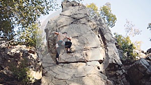 Strong topless climber breaks down