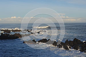 strong waves breaking and crushing on the volcanic rocks on the Atlantic Ocean on coastline