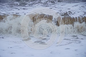 Strong waves hitting the beach