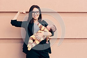Strong Woman in Business Outfit Holding Baby