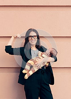 Strong Woman in Business Outfit Holding Baby