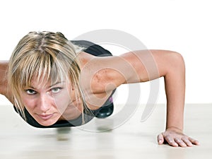 Strong woman doing push-up