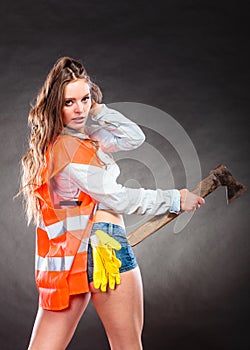 strong woman feminist with axe at work.
