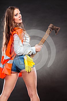 strong woman feminist with axe at work.