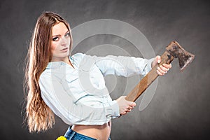 strong woman feminist with axe working.
