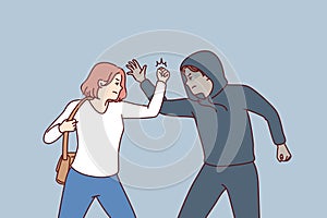 Strong woman fights back against thief by showing self-defense techniques to offender man