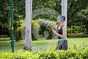 Strong Woman In Gym Outfit Running In Park In Morning