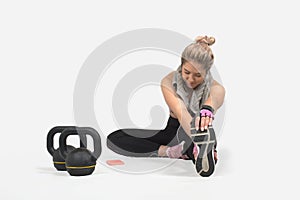 Strong woman posing with kettlebell