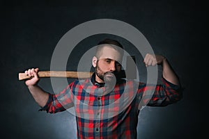 Strong woodsman with axe. Male strength