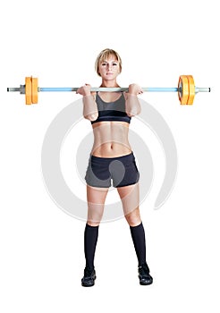 Strong young woman with barbell