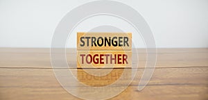 Stronger together symbol. Concept words \'stronger together\' on wooden blocks
