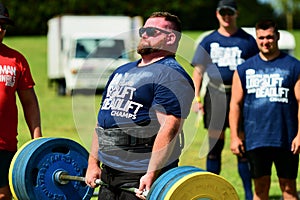 Auckland, New Zealand - Mar 2020. Strongman training in a public park, log Lift and Deadlift training