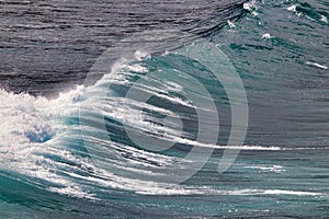 Strteaing motion of a beautiful aquamareine wave flowing towards the shore.