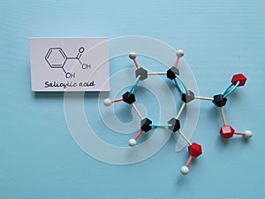 Structural chemical formula and molecular structure of salicylic acid molecule. Salicylic acid is a skincare ingredient