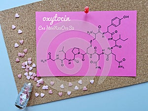 Structural chemical formula of oxytocin with decorations in the shape of heart. Oxytocin is known as the love hormone.