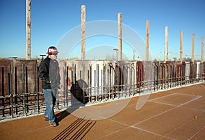 Structural concrete supervisor surveys deck;