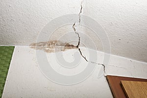 Structural damage on ceiling, mold in corner, crack in ceiling photo