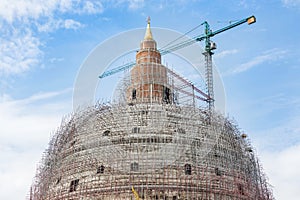 Structure of big pagoda stupa under construction with crane
