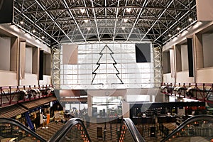 Structure of large shopping hall or department store showcases large glass windows