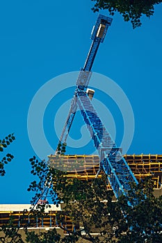 Structure of a new concrete building and hoisting crane