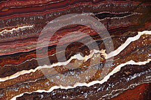 The structure of Onyx, a bright red color with dark streaks and waves, is called Onyx Fantastico photo