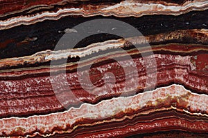 The structure of Onyx, a bright red color with thin veins and waves, is called Onice Fantastico photo