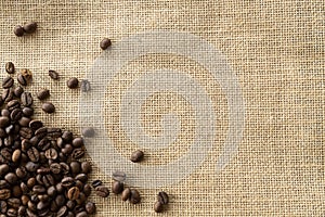 Structured linen background with roasted coffee beans