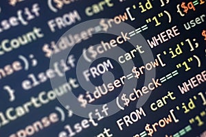 Structured sql code on monitor. SQL code on a dark background development concept