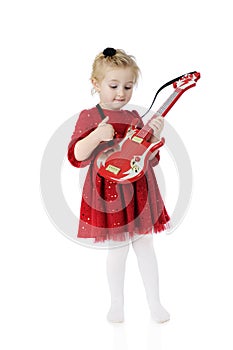 Strumming Her Toy Guitar