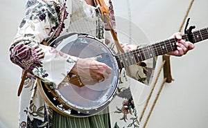 Strumming an old banjo