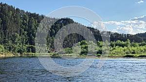 Strunning view of calm water of Agidel river in summer during rafting