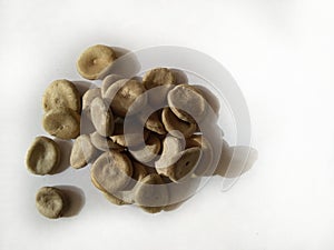 Strychnos nux vomica or poison nut seeds. It is also called Kuchala,Zahra, Kajra etc.