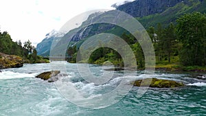 Stryn village and blue lake, beautiful nature of Norway lakes and mountains, Aerial