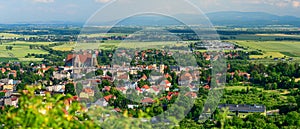 Strzegom, view of the city from the viewpoint on the top of Krzyzowa Mountain. Vast landscape for urban buildings with mountains