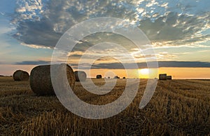 Stubble field and hay bales