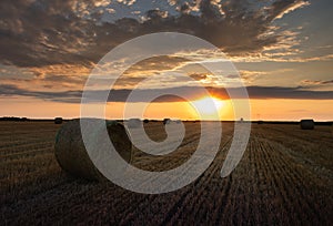 Stubble field and hay bales