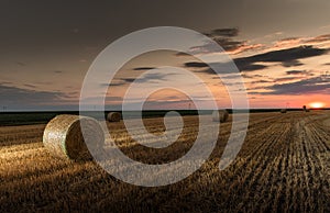 Stubble field and hay bales