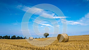 Stubble field with straw bales