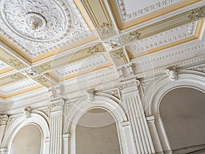 Stucco ceiling and wall. Molding, cornice. Old plaster architectural elements of the interior