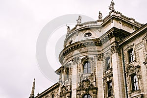 Stucco pediments and statues on the roof of the Palace of Justice in Munich photo