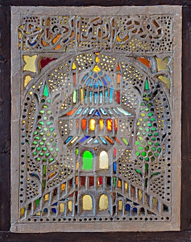 Stucco window decorated with colorful stain glass with floral patterns, a traditions of the Ottoman era