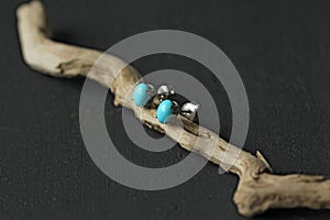 Stud earrings made of natural turquoise sleeping beauty. Designer earrings from natural turquoise stones. Women`s jewelry on a