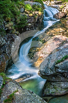 The Studenovodske waterfalls on a stream in the forest