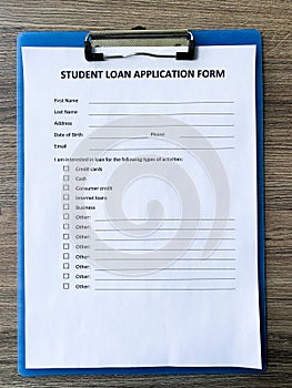 Student application loan form document on table.