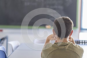 Student attending in a classroom during a lesson