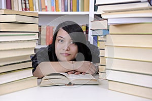 Student with books in a library