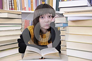 Student with books in a library