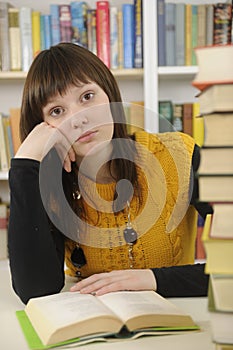Student with books in a library