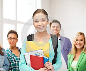 Student with books and schoolbag