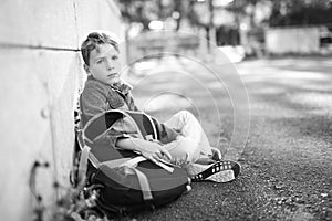 Student boy outside at school standing